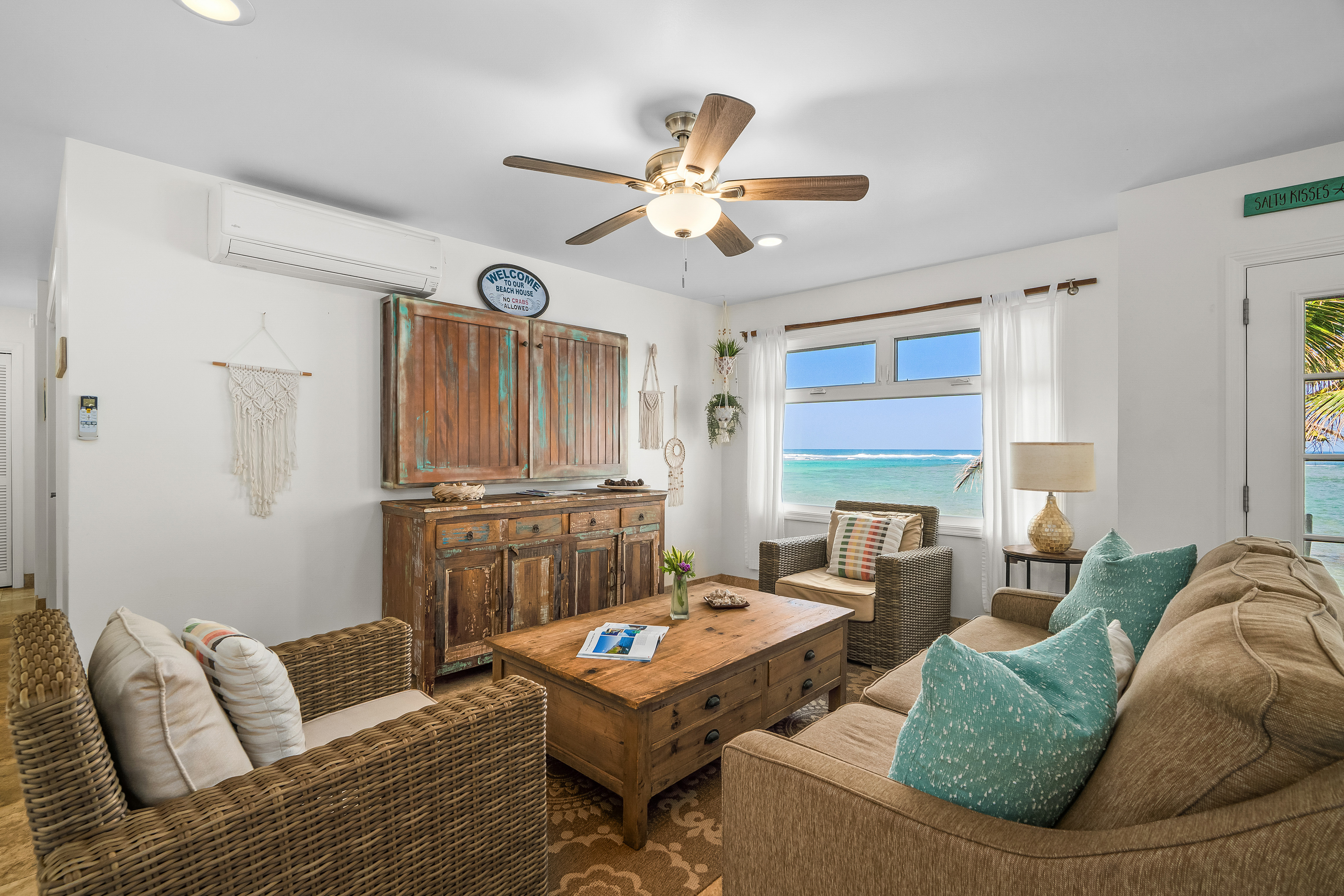 4910 Aliomanu Road Anahola, HI 96703 - Photo 4 of 30 a living room with furniture a fireplace and a window