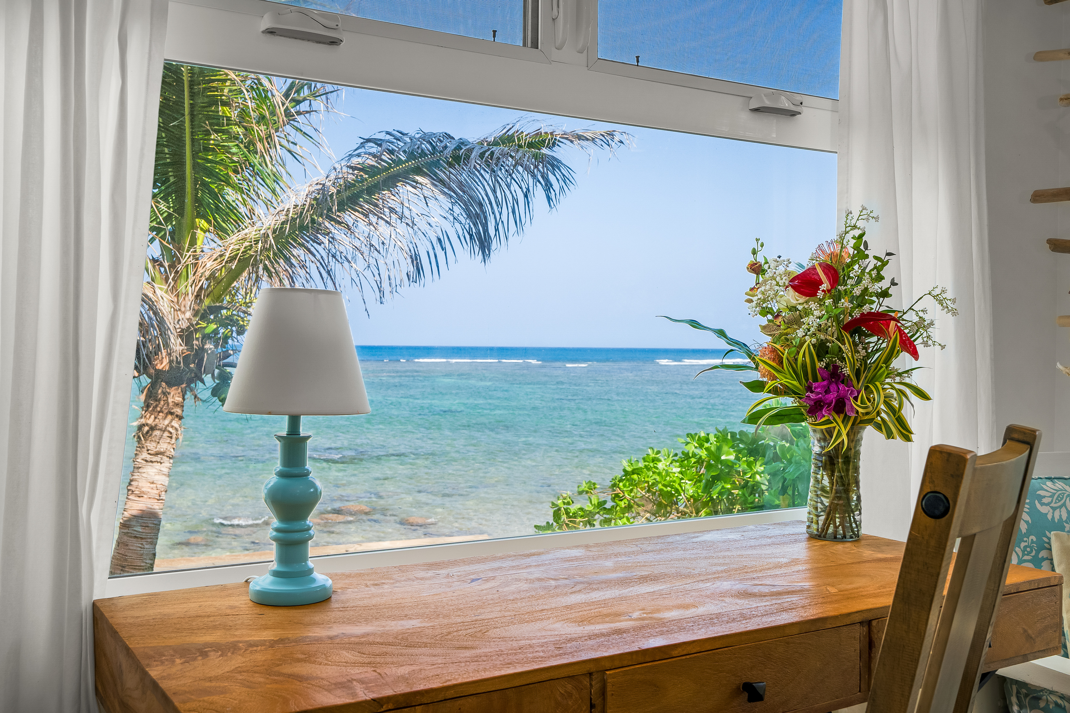 4910 Aliomanu Road Anahola, HI 96703 - Photo 7 of 30 a vase of flowers sitting on a table