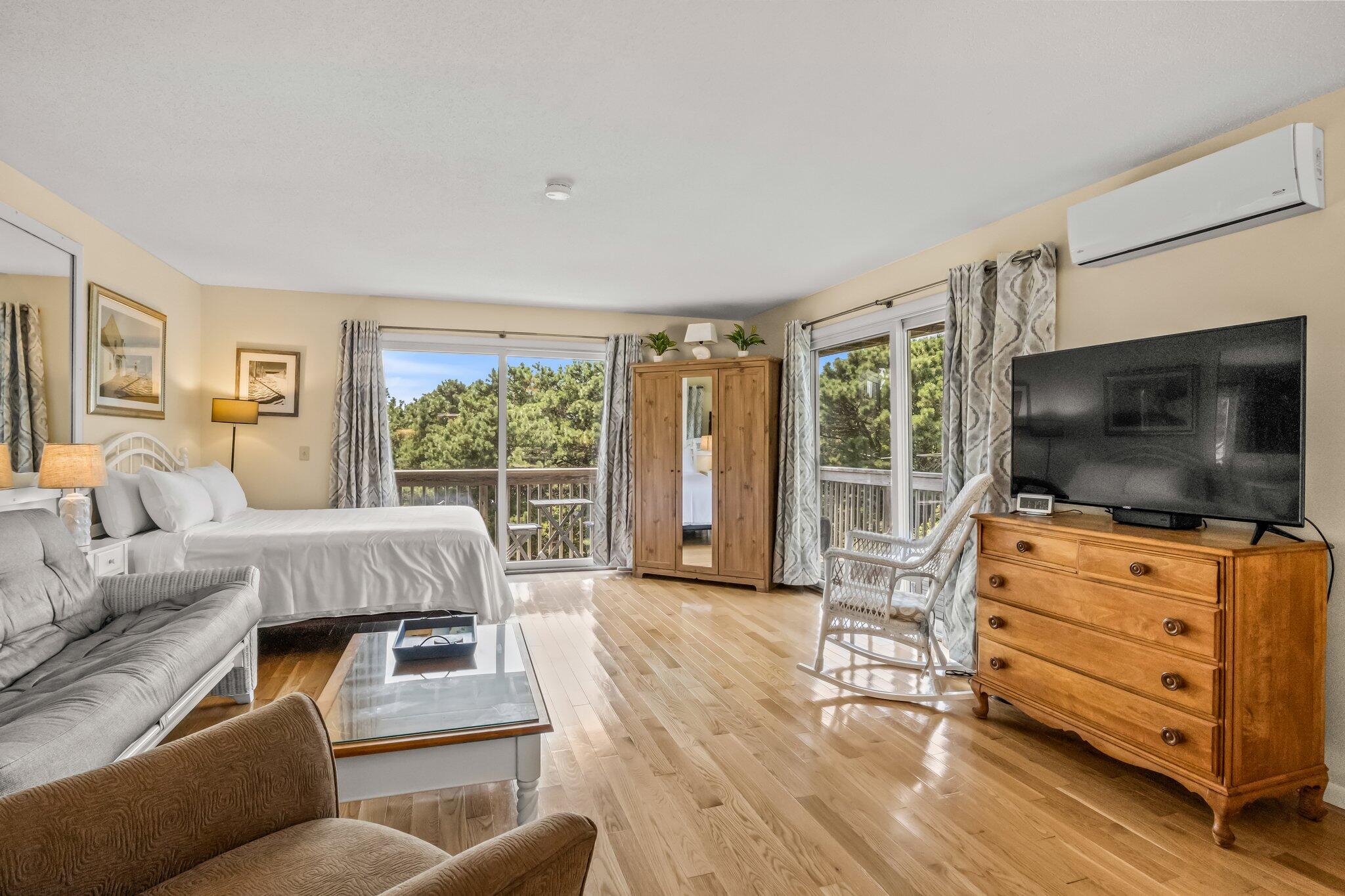 132 Shore Road, Unit 31 Truro, MA 02666 - Photo 1 of 24 a living room with furniture and a flat screen tv
