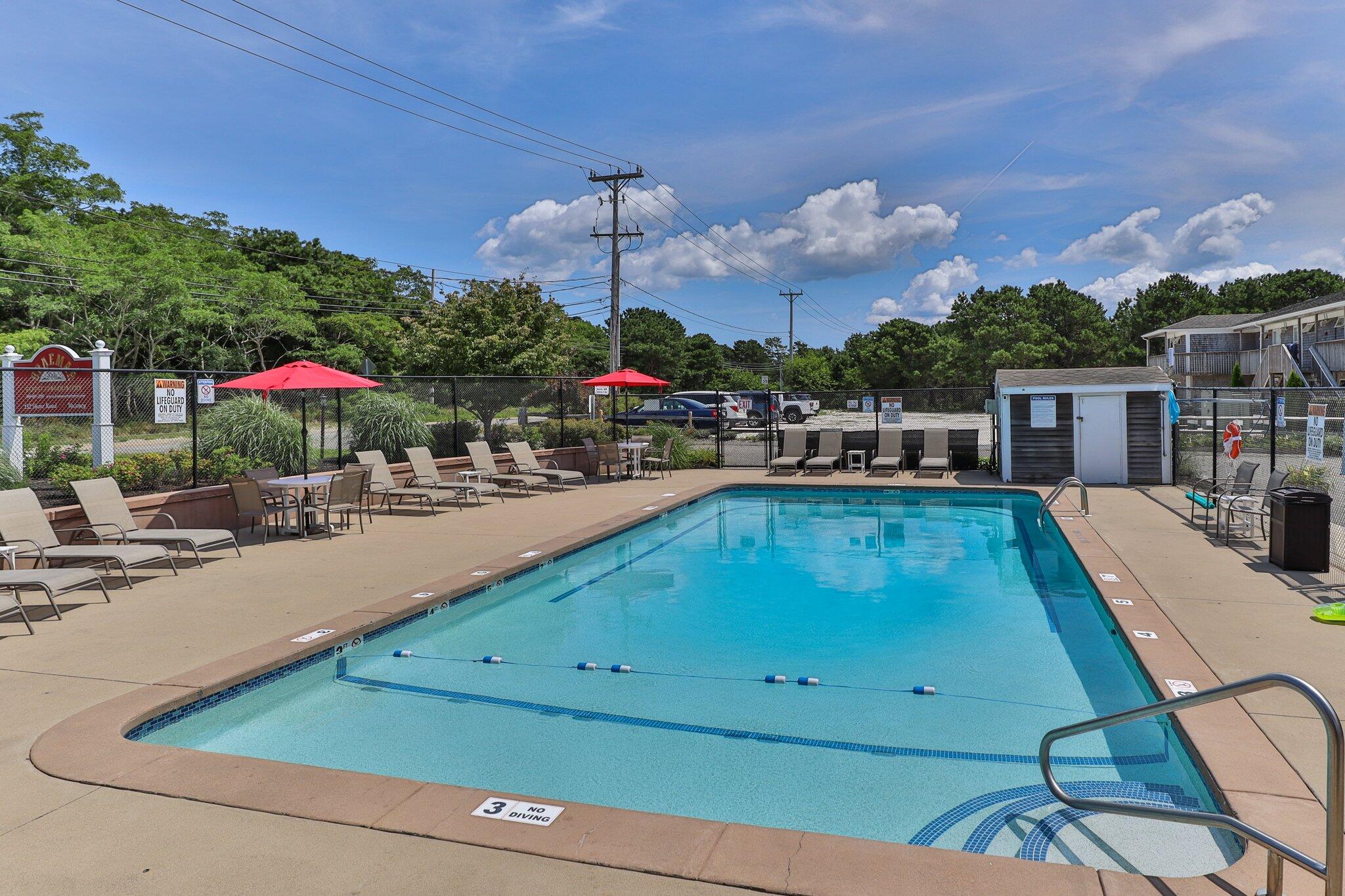 132 Shore Road, Unit 31 Truro, MA 02666 - Photo 12 of 24 a view of a swimming pool with a lounge chairs