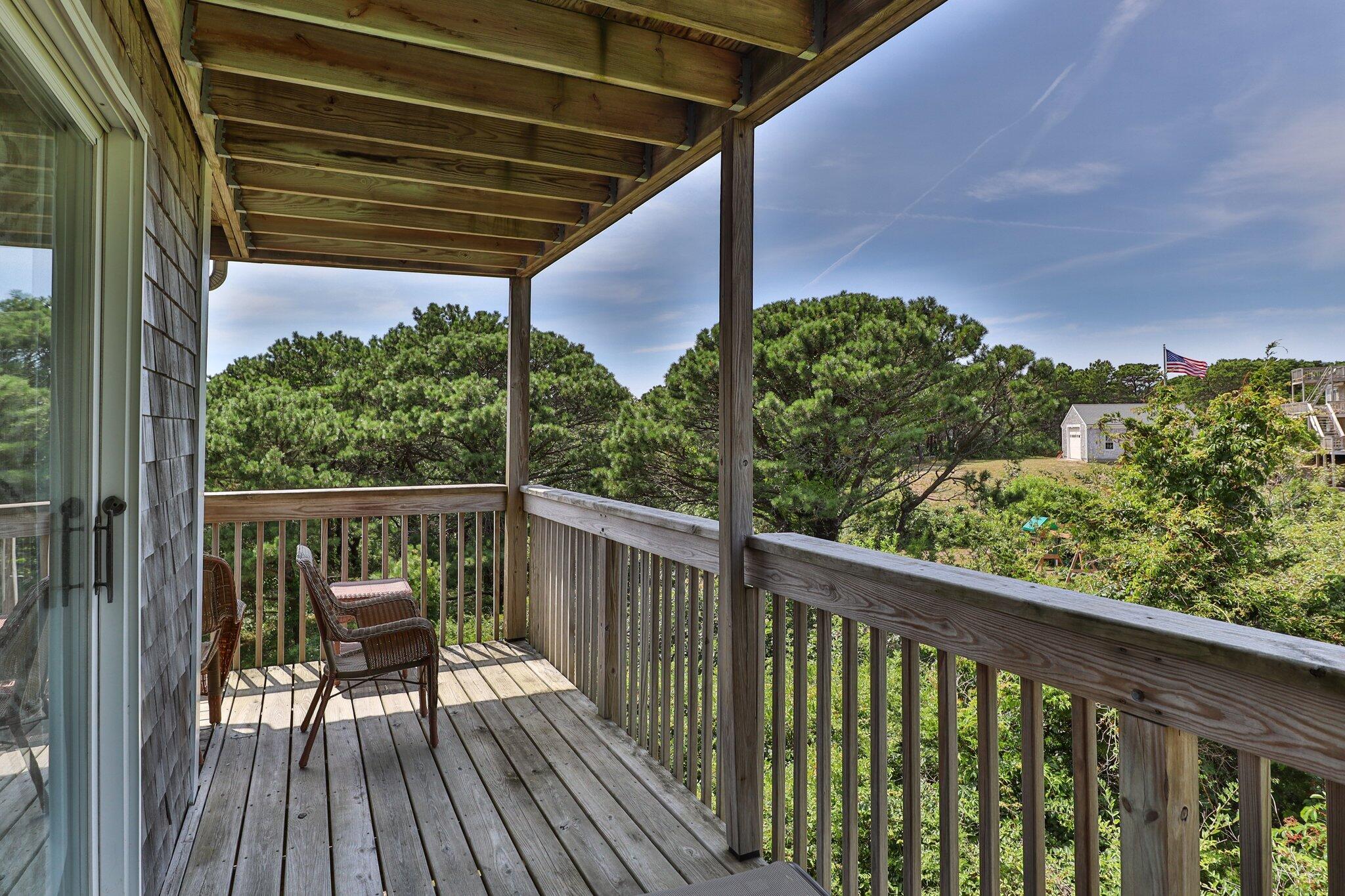132 Shore Road, Unit 31 Truro, MA 02666 - Photo 22 of 24 a view of a balcony with wooden floor