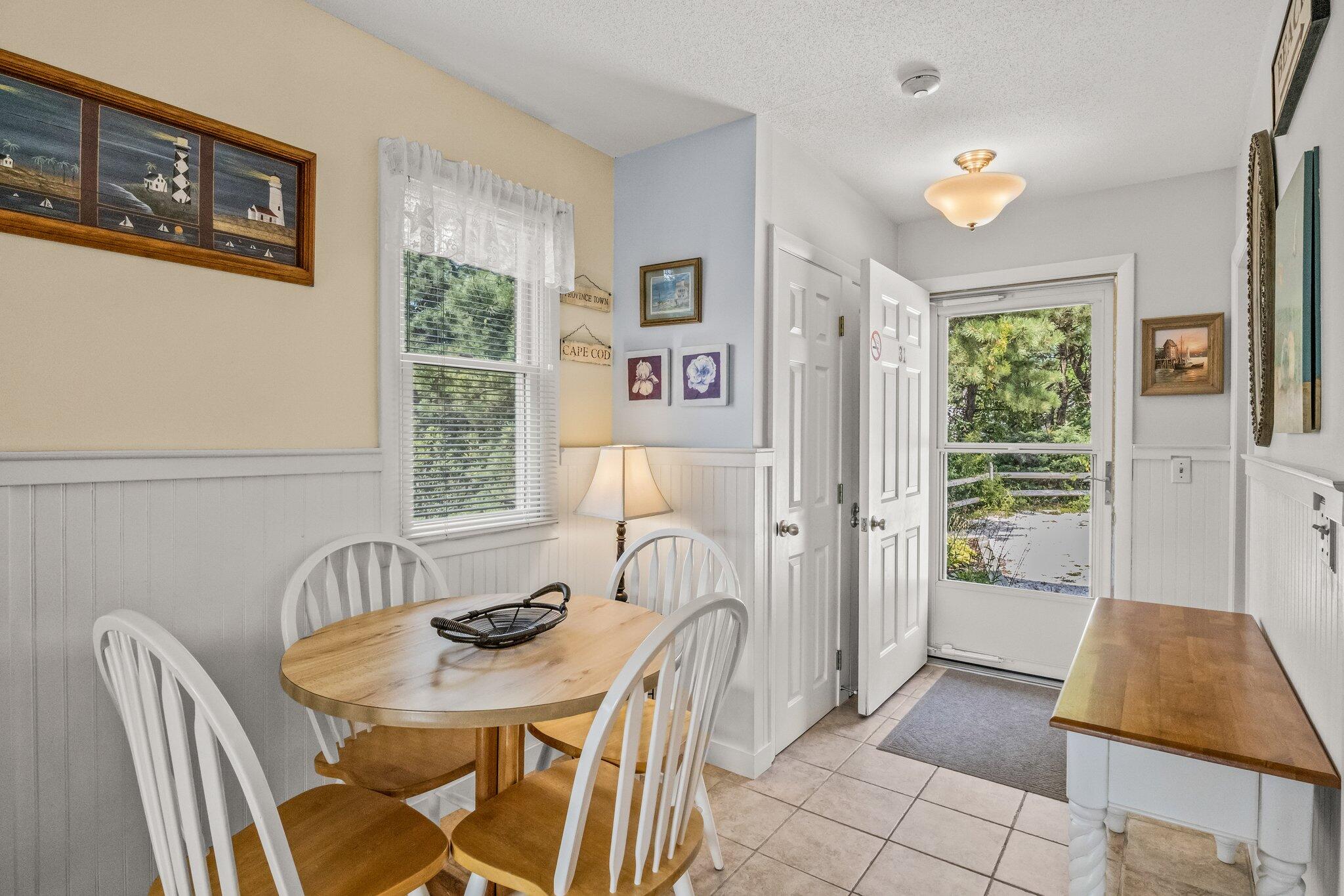 132 Shore Road, Unit 31 Truro, MA 02666 - Photo 3 of 24 a view of a dining room with furniture window and outside view