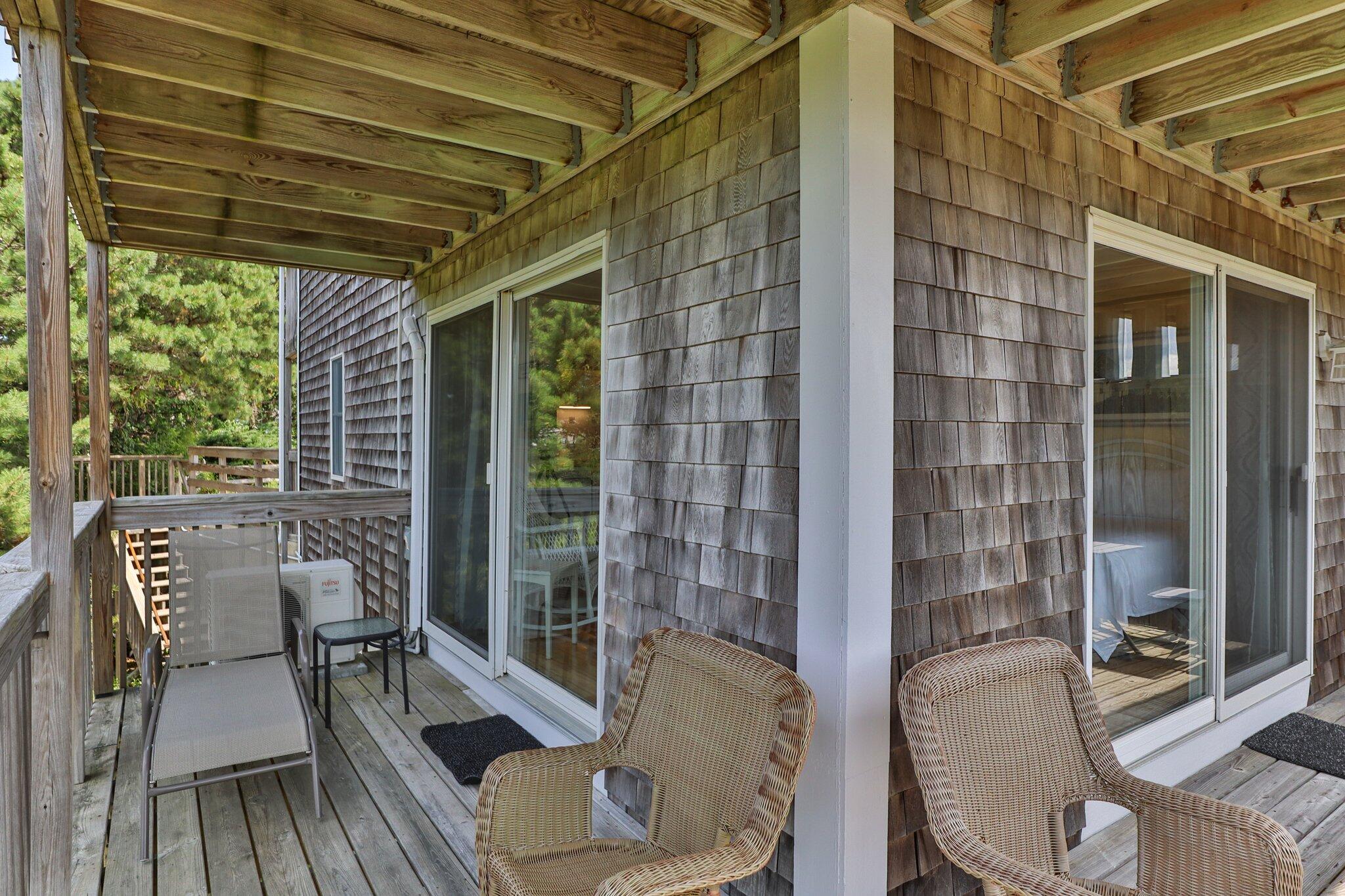 132 Shore Road, Unit 31 Truro, MA 02666 - Photo 10 of 24 a balcony with furniture and wooden floor