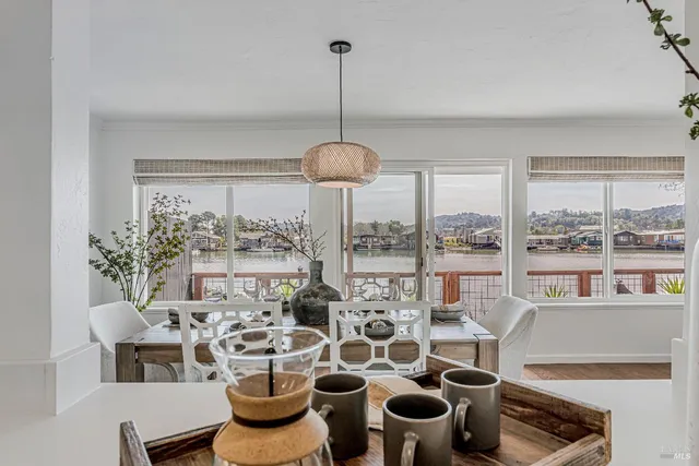 a view of a dining room with furniture window and outside view
