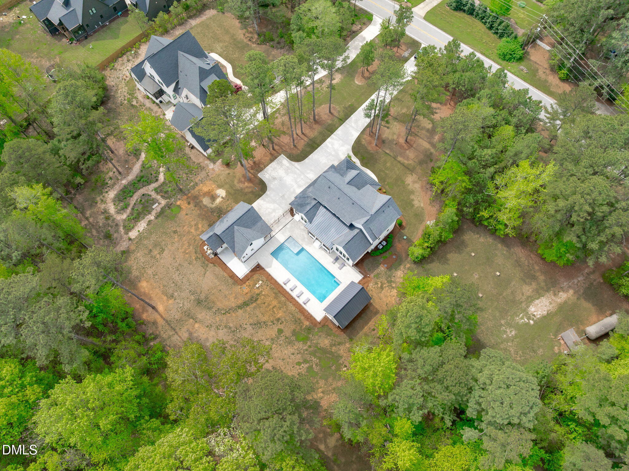 5005 Ten-Ten Road Apex, NC 27539 - Photo 56 of 60 Note size of pool, patio, and outdoor kitchen space.