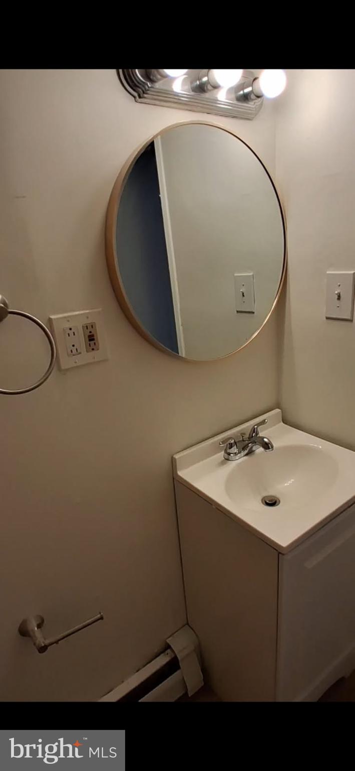 334 Middlesex Street Gloucester City, NJ 08030 - Photo 10 of 12 a sink with a washer and dryer