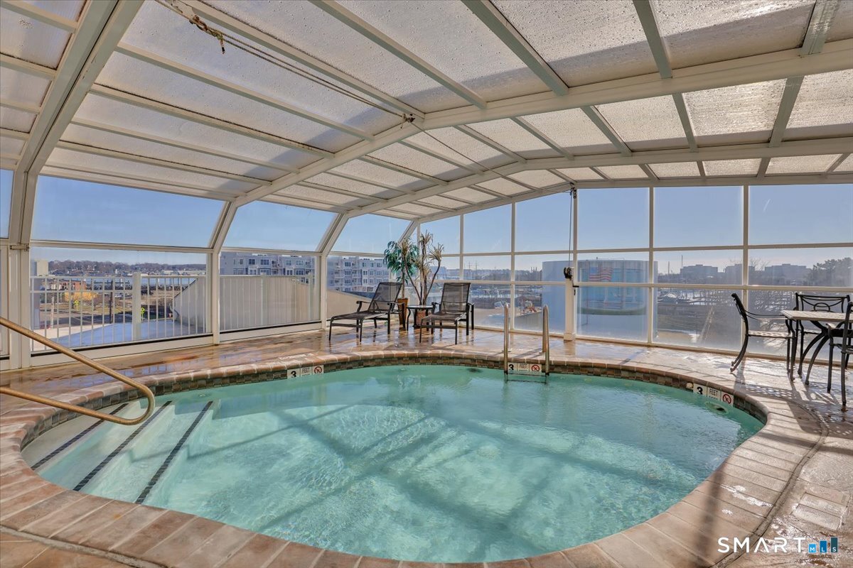461 Bank Street, Unit 606 New London, CT 06320 - Photo 33 of 37 Solar heated indoor/outdoor pool with a retractable glass roof for year round enjoyment.