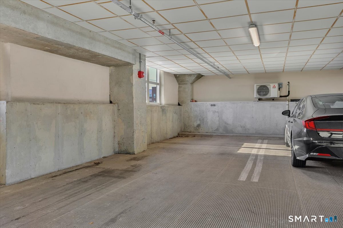 461 Bank Street, Unit 606 New London, CT 06320 - Photo 33 of 35 a view of parking garage with cars