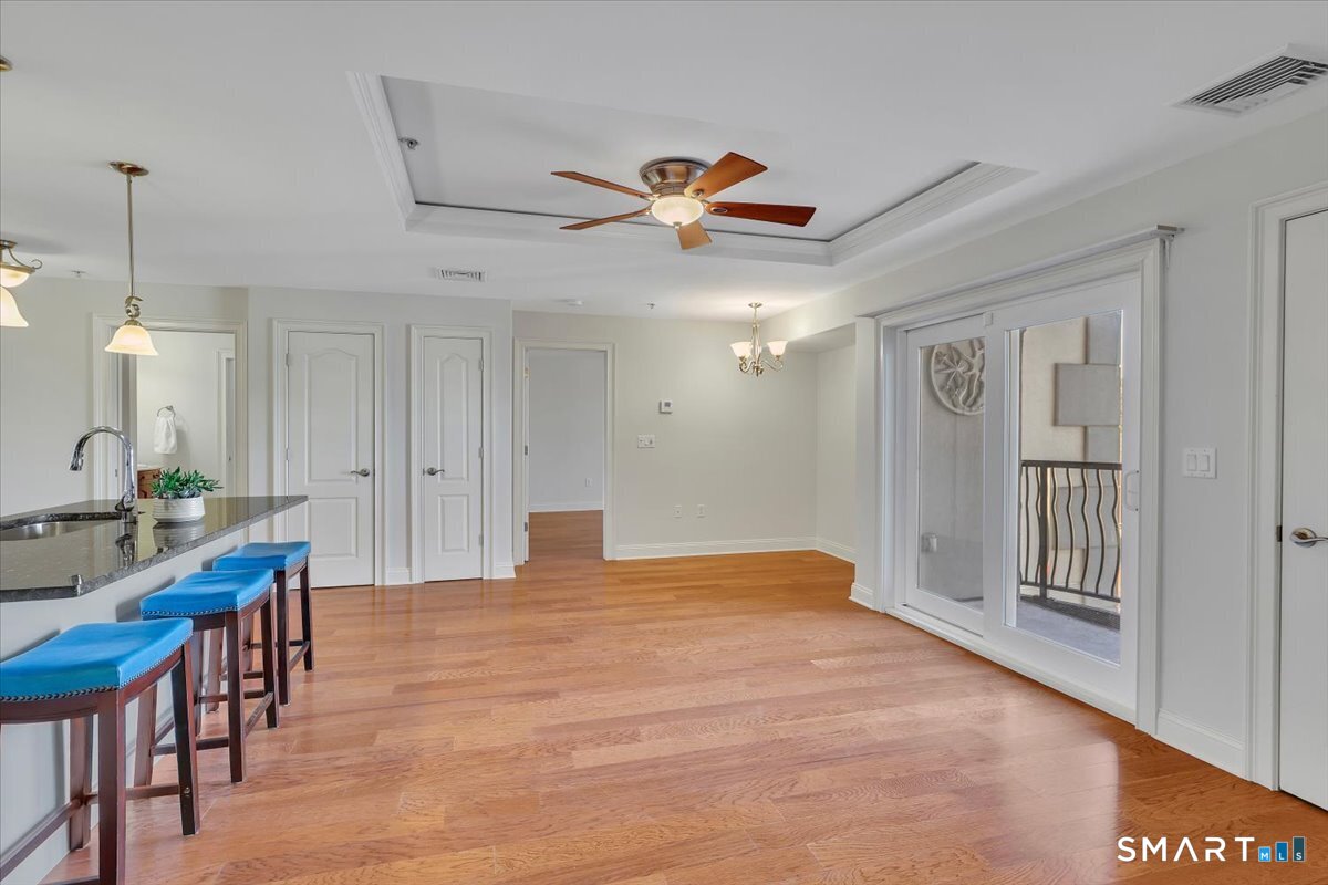 461 Bank Street, Unit 606 New London, CT 06320 - Photo 7 of 37 Background doors offer added storage, with a large pantry on the left and a coat closet on the right.