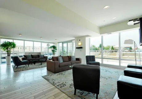 a living room with furniture and a large window
