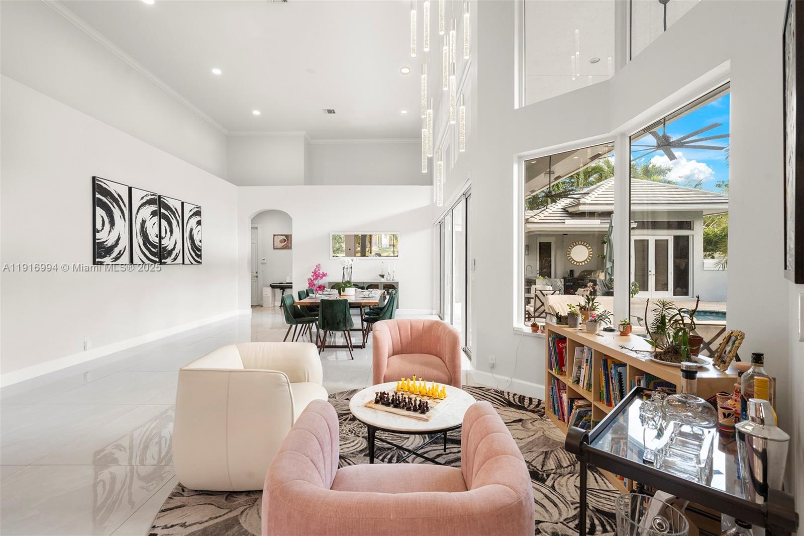 6451 Northwest 32nd Way Boca Raton, FL 33496 - Photo 12 of 54 a living room with furniture and a window