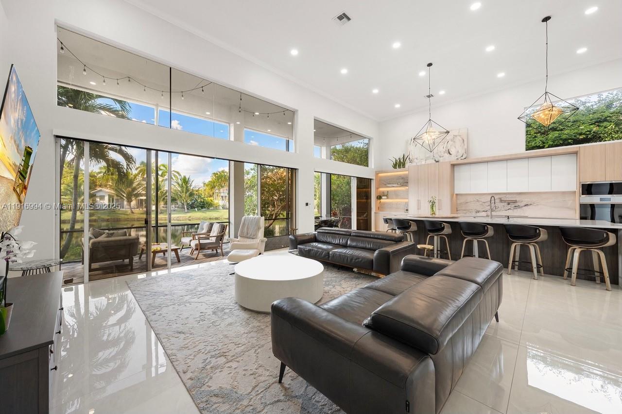 6451 Northwest 32nd Way Boca Raton, FL 33496 - Photo 16 of 54 a living room with furniture and a large window