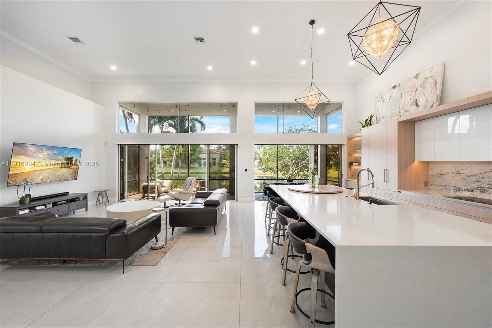 6451 Northwest 32nd Way Boca Raton, FL 33496 - Photo 18 of 54 a kitchen with counter space appliances and furniture