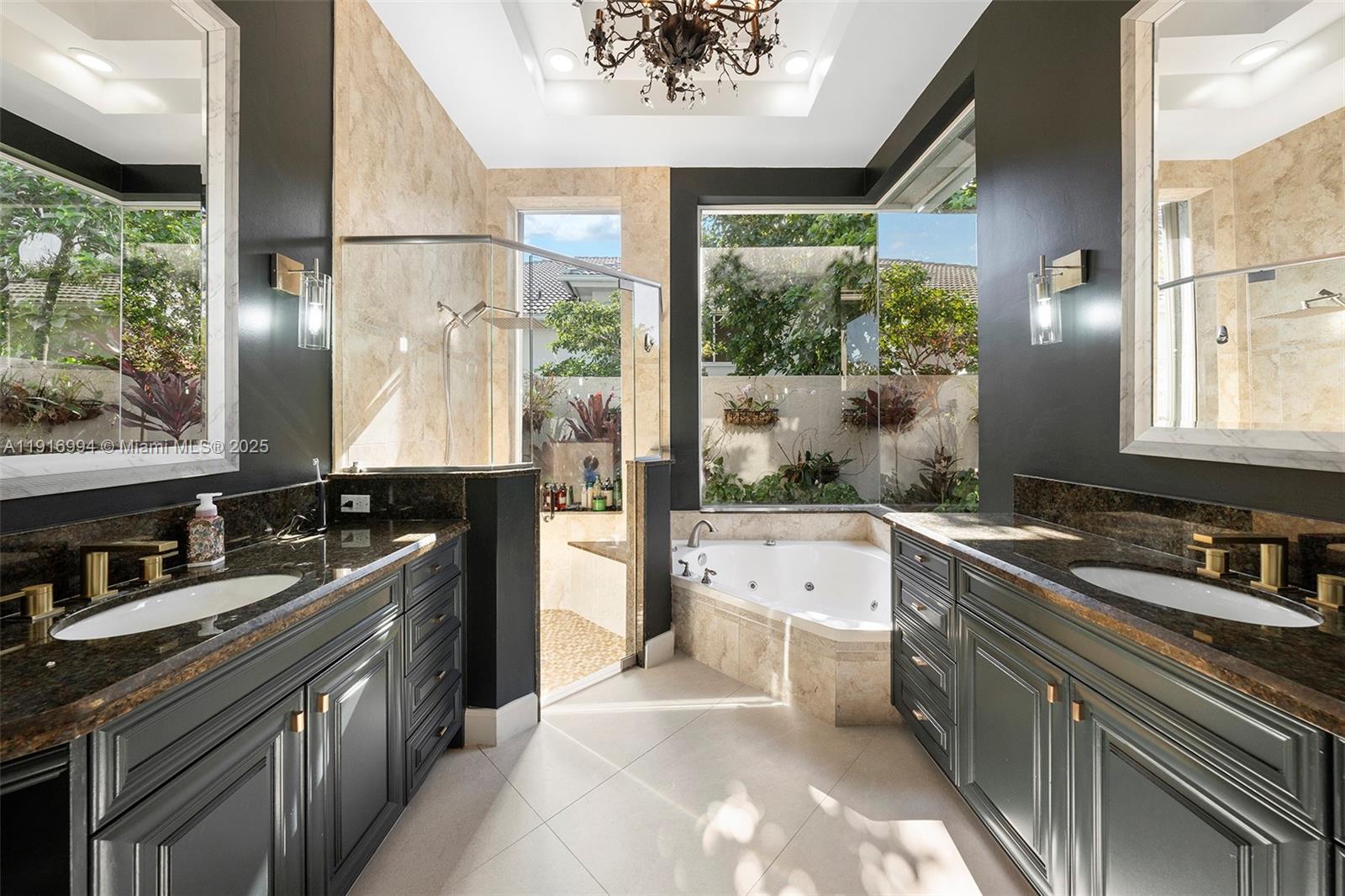 6451 Northwest 32nd Way Boca Raton, FL 33496 - Photo 21 of 54 a large kitchen with kitchen island a large window in it