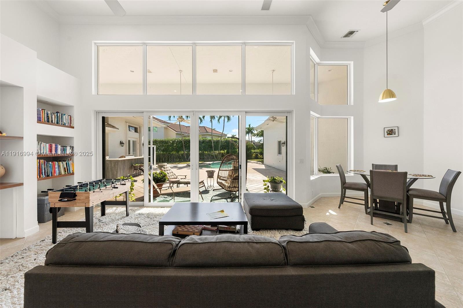 6451 Northwest 32nd Way Boca Raton, FL 33496 - Photo 39 of 54 a living room with furniture and large window
