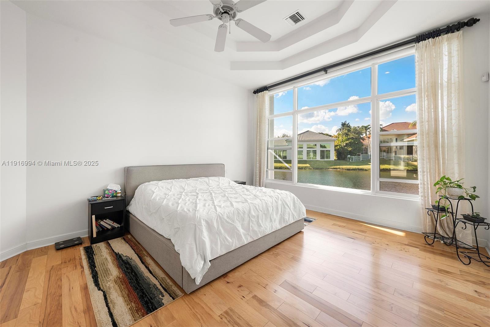 6451 Northwest 32nd Way Boca Raton, FL 33496 - Photo 47 of 54 a large bed sitting in a bedroom next to a window