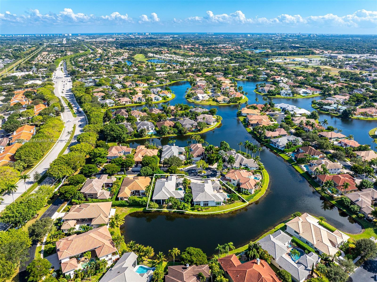 6451 Northwest 32nd Way Boca Raton, FL 33496 - Photo 5 of 54 an aerial view of a house with a swimming pool yard and outdoor seating