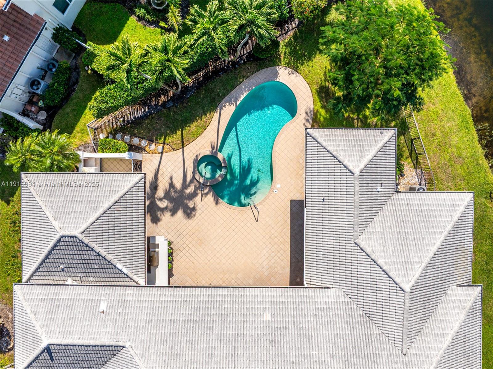 6451 Northwest 32nd Way Boca Raton, FL 33496 - Photo 54 of 54 an aerial view of a house with swimming pool
