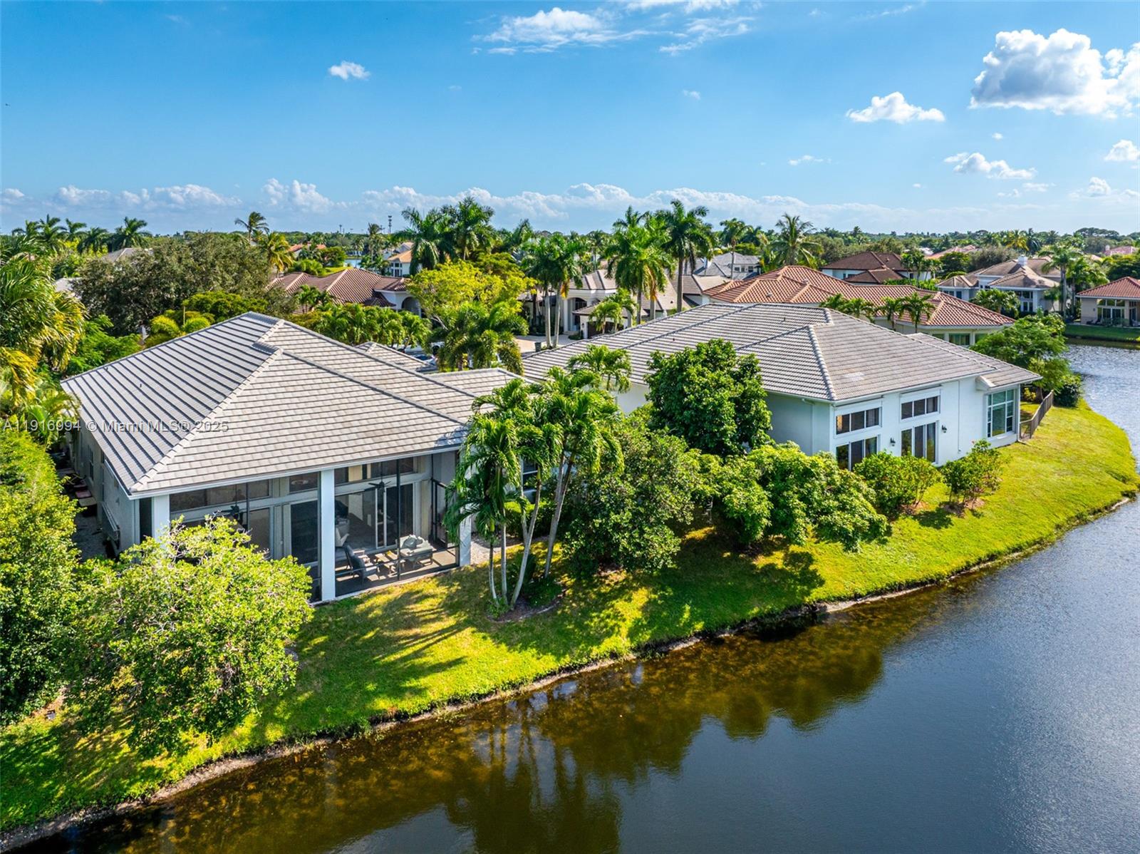 6451 Northwest 32nd Way Boca Raton, FL 33496 - Photo 8 of 54 a aerial view of a house with a garden and lake view