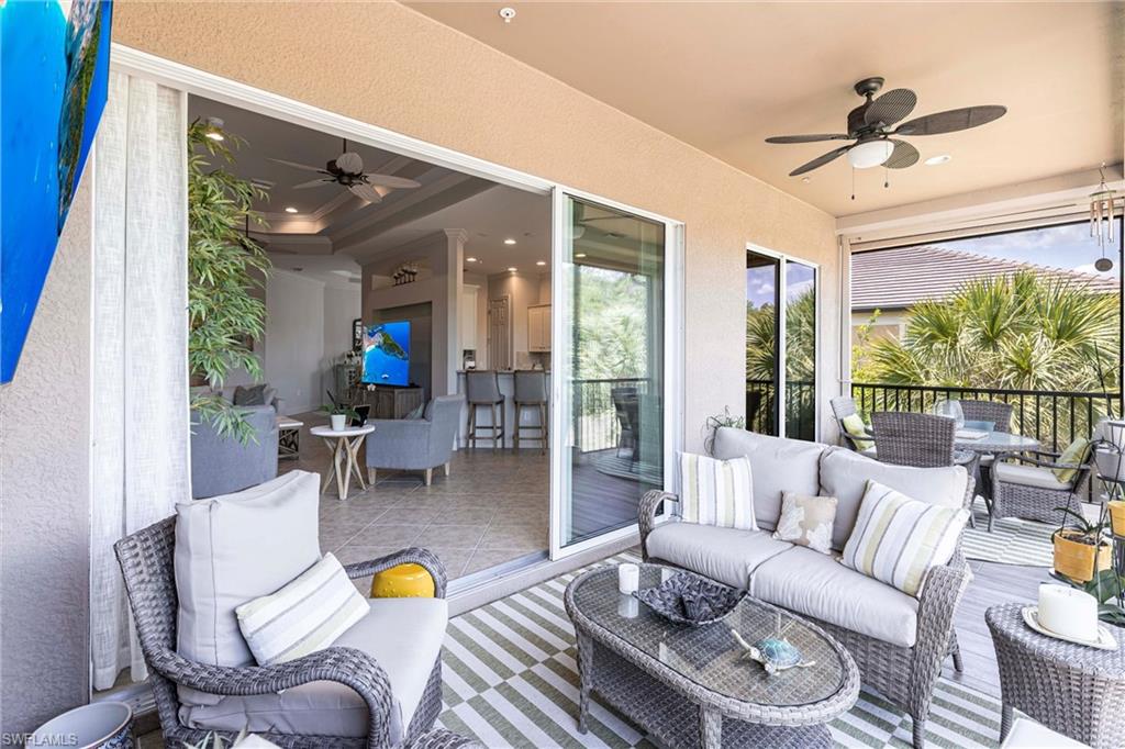 9550 Ironstone Terrace, Unit 201 Naples, FL 34120 - Photo 39 of 50 View of patio with ceiling fan, an outdoor living space, and outdoor dining area