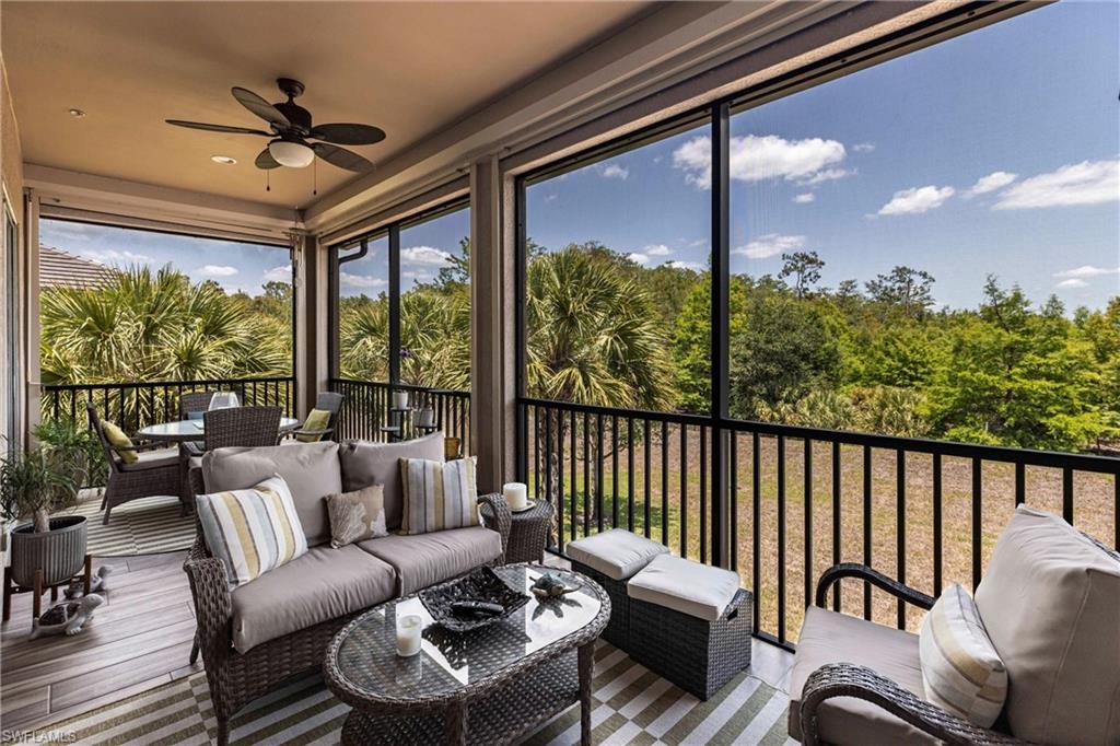 9550 Ironstone Terrace, Unit 201 Naples, FL 34120 - Photo 41 of 50 Sunroom with a ceiling fan, an outdoor hangout area, outdoor dining space, and plenty of natural light