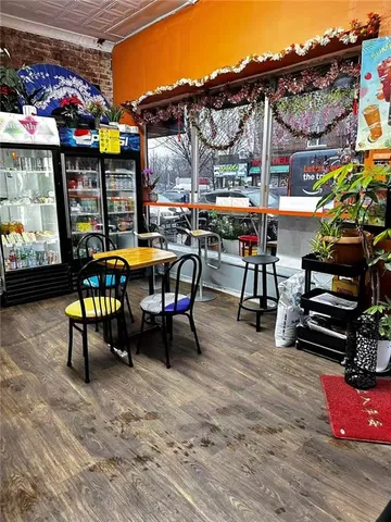 a view of street with sitting area