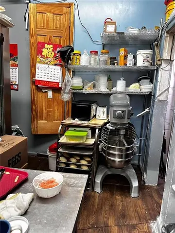 a room with furniture and a wooden floor