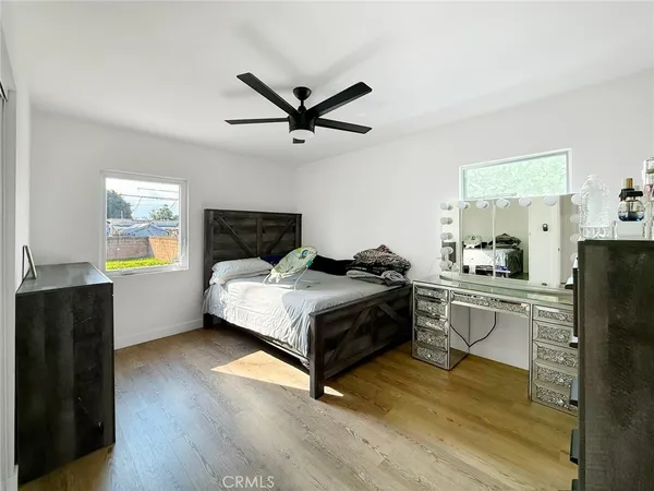 a living room with a bed furniture and a window