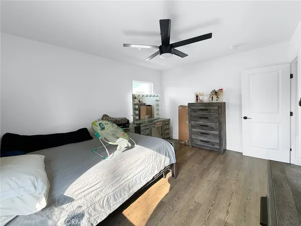 a bedroom with bed and window