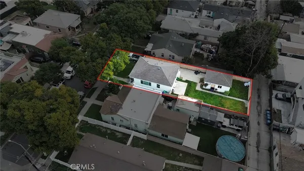 an aerial view of residential house with parking