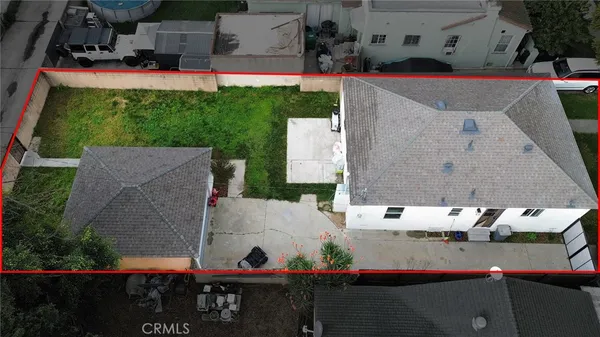 an aerial view of multiple houses with outdoor space