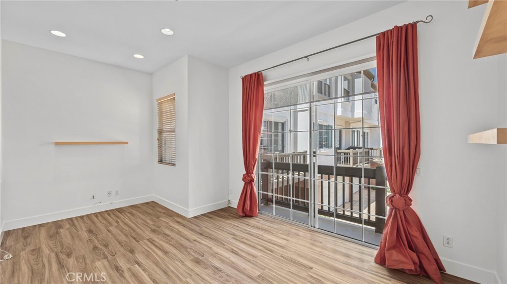 12626 Nicklaus Lane Tustin, CA 92782 - Photo 14 of 36 a view of a room with wooden floor and a window