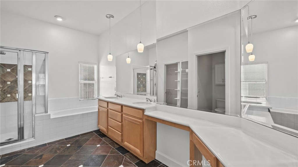 12626 Nicklaus Lane Tustin, CA 92782 - Photo 20 of 36 a large white kitchen with a large window