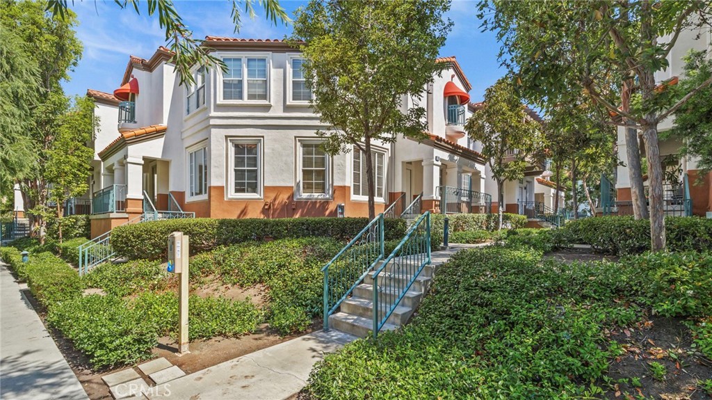 12626 Nicklaus Lane Tustin, CA 92782 - Photo 2 of 36 front view of a house with a yard