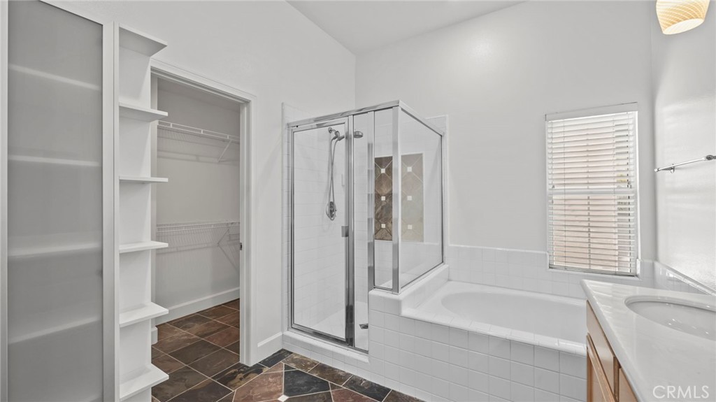 12626 Nicklaus Lane Tustin, CA 92782 - Photo 22 of 36 a bathroom with a bathtub and a shower