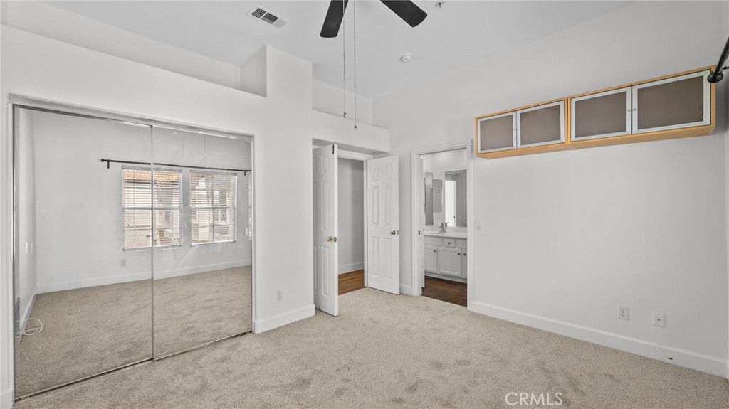 12626 Nicklaus Lane Tustin, CA 92782 - Photo 24 of 36 a view of an empty room with chandelier fan and fire place