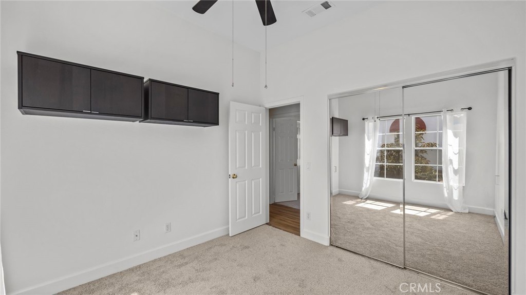 12626 Nicklaus Lane Tustin, CA 92782 - Photo 27 of 36 a view of an empty room with windows