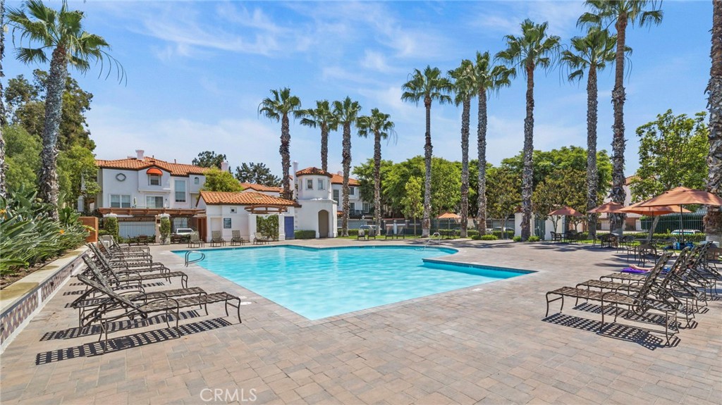 12626 Nicklaus Lane Tustin, CA 92782 - Photo 33 of 36 front view of a house with a yard and palm trees