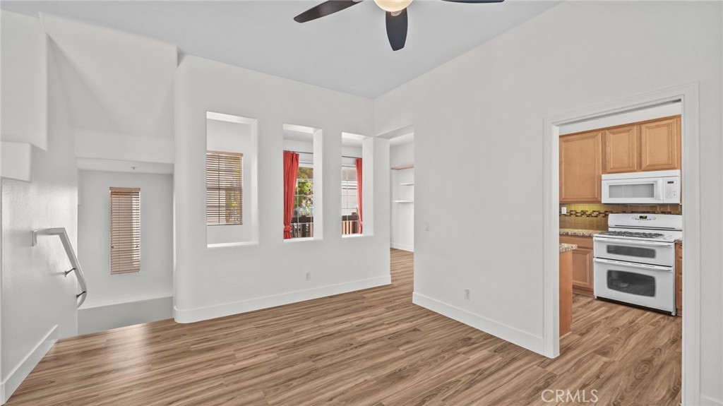 12626 Nicklaus Lane Tustin, CA 92782 - Photo 9 of 36 wooden floor in an empty room with a window