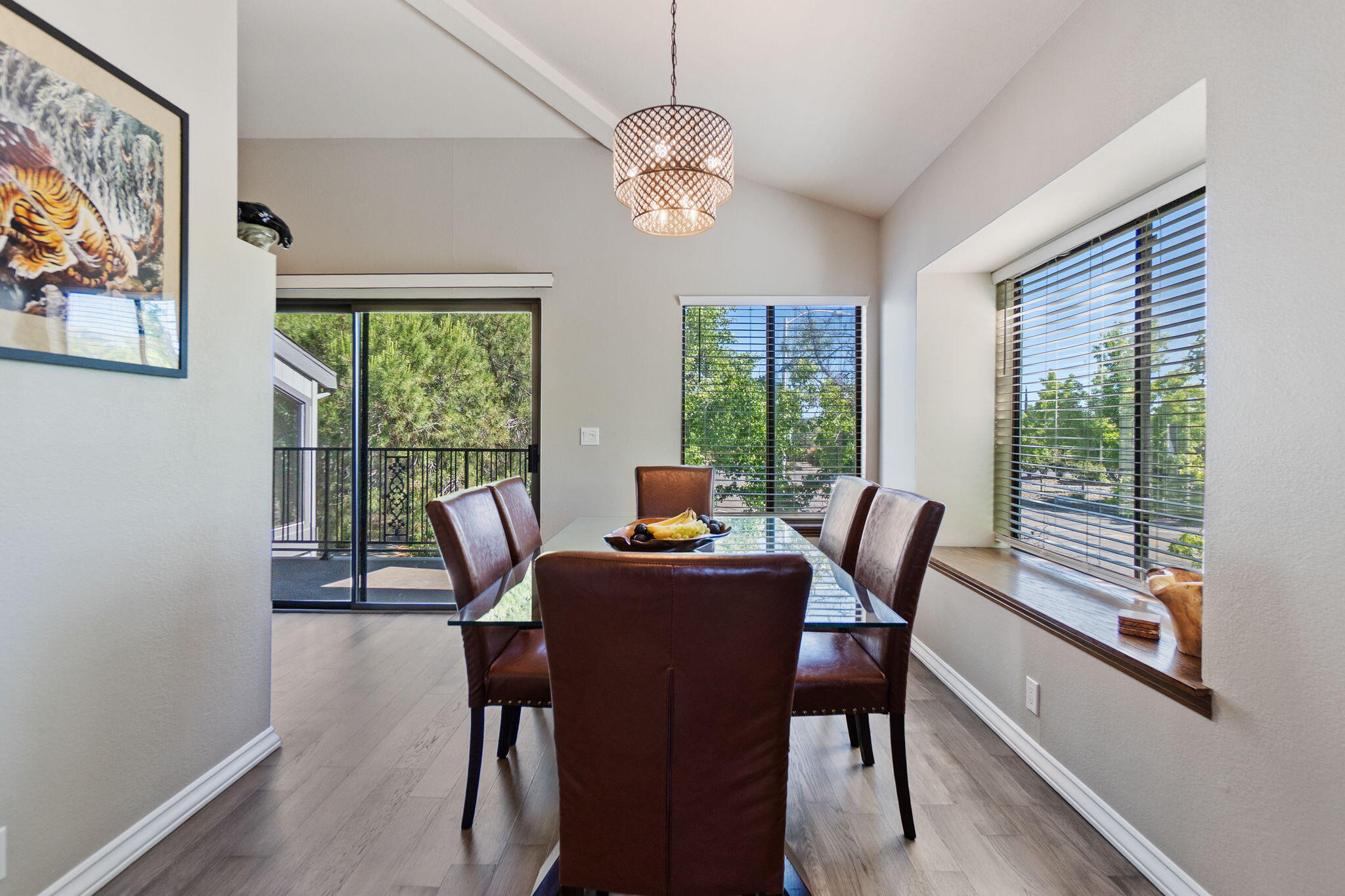 426 Ridgecrest Trail, Unit 223 Redding, CA 96003 - Photo 17 of 59 a dining room with furniture a chandelier and wooden floor