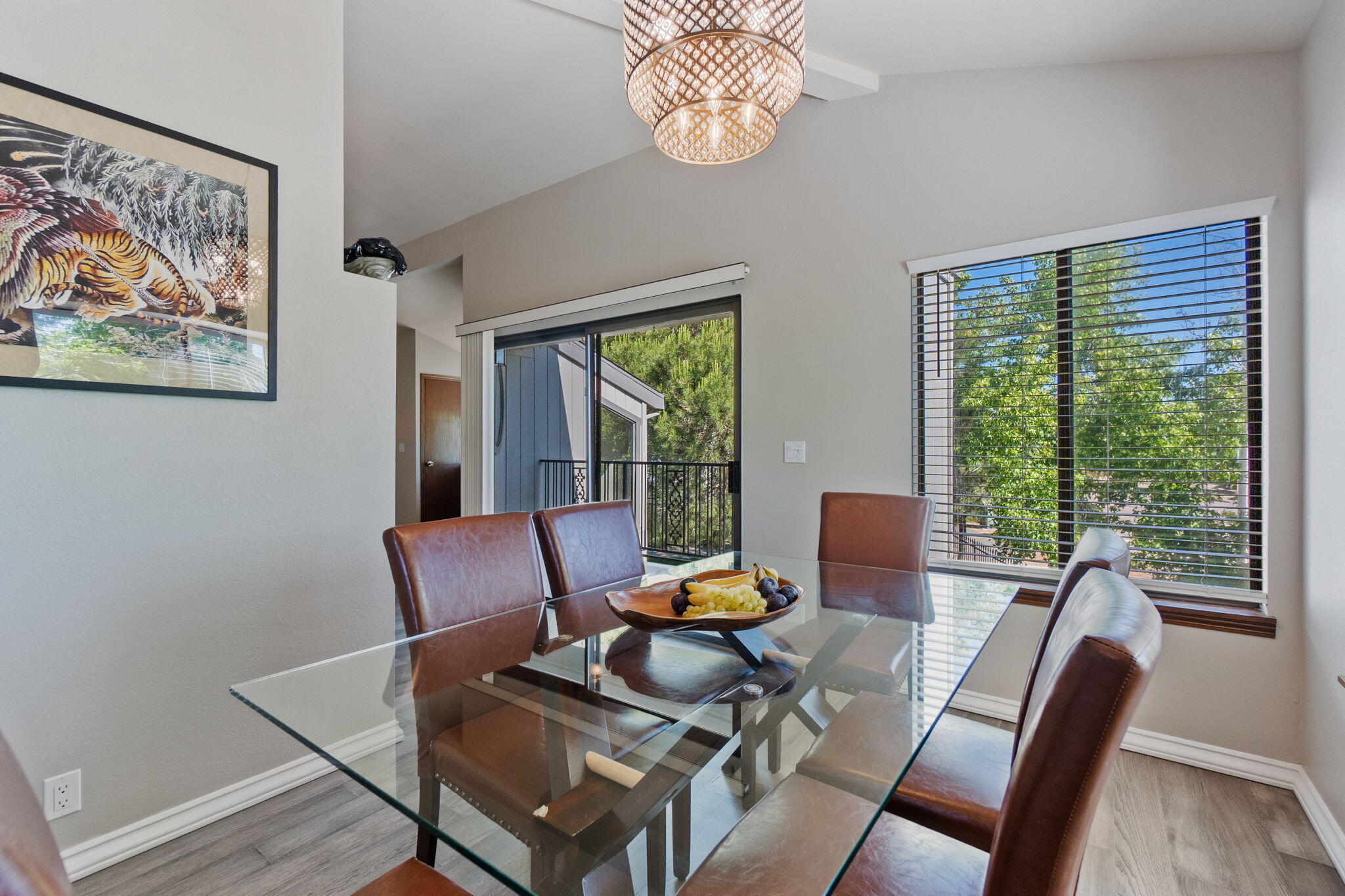 426 Ridgecrest Trail, Unit 223 Redding, CA 96003 - Photo 18 of 59 a view of a dining room with furniture a chandelier and wooden floor