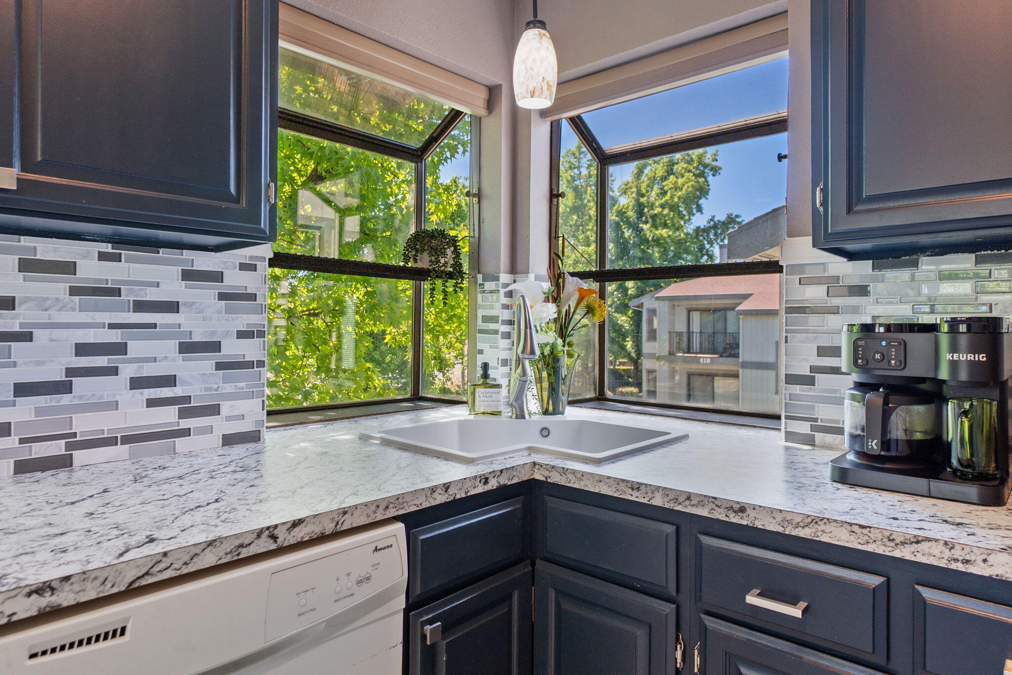426 Ridgecrest Trail, Unit 223 Redding, CA 96003 - Photo 20 of 59 a kitchen with large windows and sink