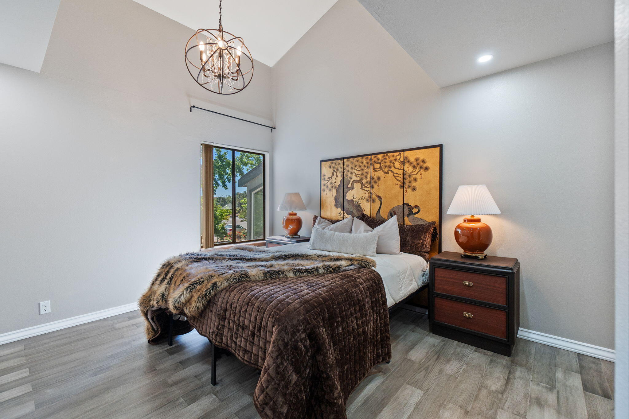 426 Ridgecrest Trail, Unit 223 Redding, CA 96003 - Photo 22 of 59 a bedroom with a bed and wooden floor