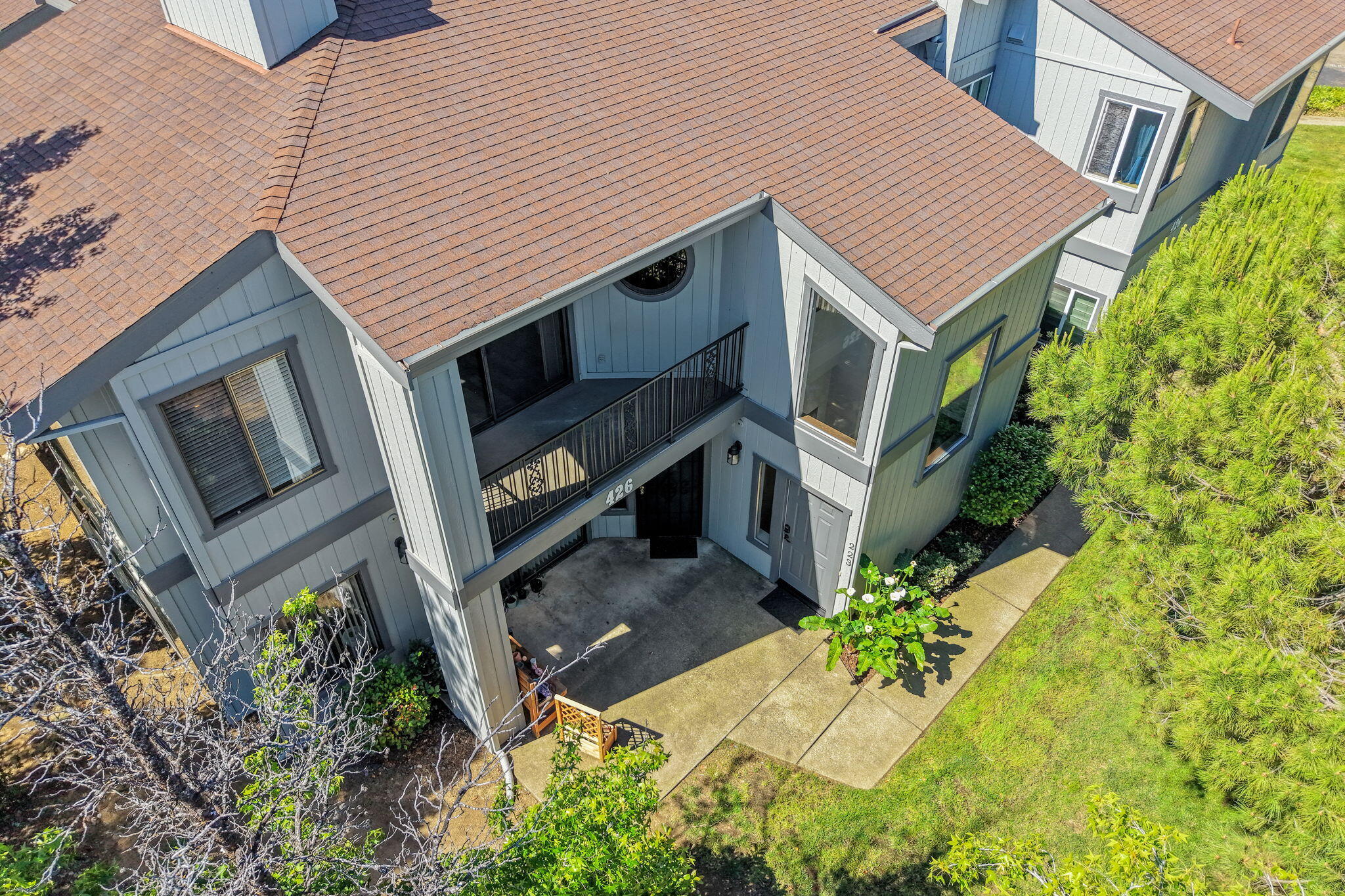426 Ridgecrest Trail, Unit 223 Redding, CA 96003 - Photo 38 of 59 a aerial view of a house with a yard and potted plants