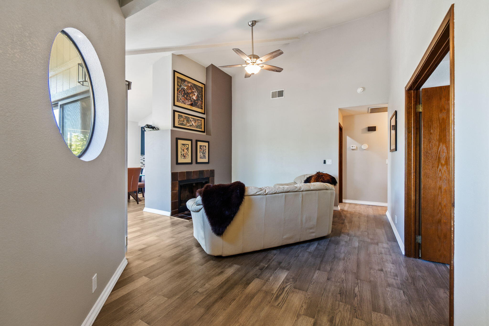 426 Ridgecrest Trail, Unit 223 Redding, CA 96003 - Photo 7 of 59 a living room with furniture and a mirror