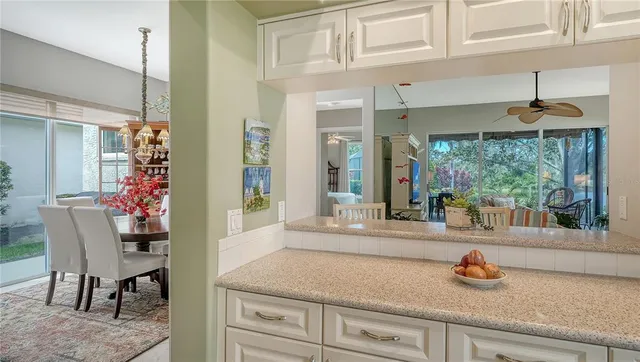 a living room with furniture and a book shelf