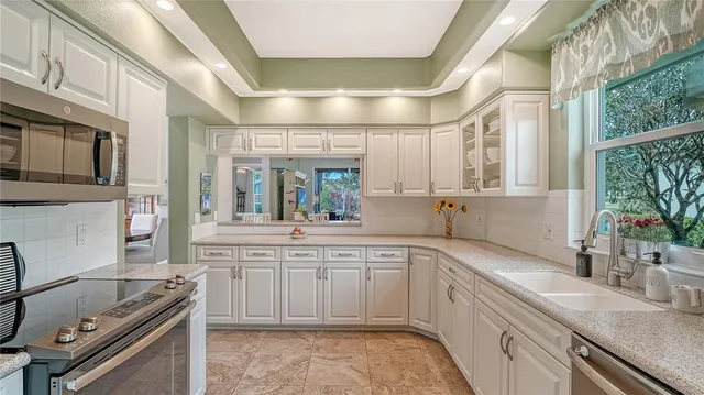 an aerial view of a house with a lake view