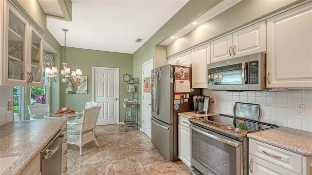 a room with lots of chairs and mirrors