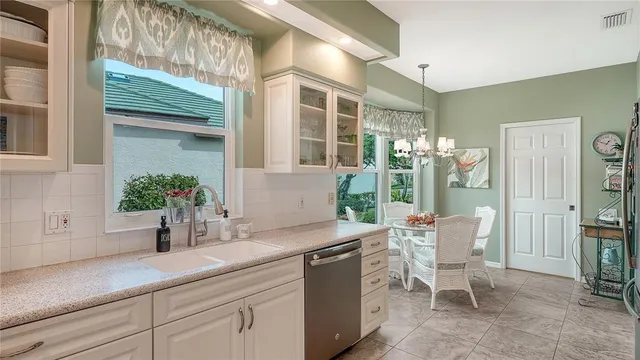 a living room with furniture a wooden floor and floor to ceiling windows
