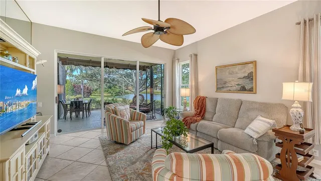 a backyard of a house with table and chairs and wooden floor